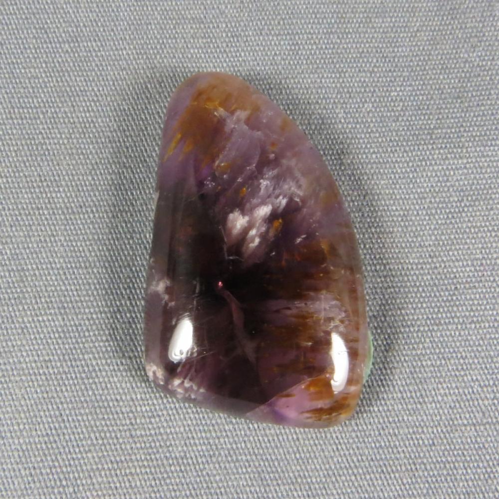 Cacoxenite in Amethyst Cabochon