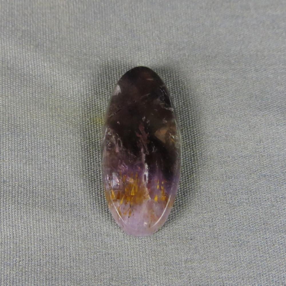 Cacoxenite in Amethyst Cabochon