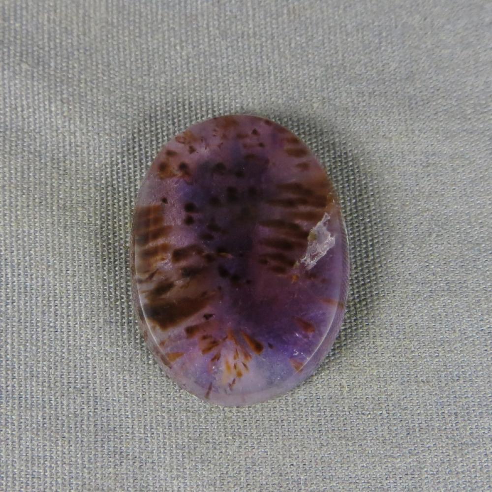Cacoxenite in Amethyst Cabochon