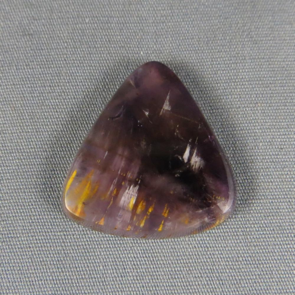 Cacoxenite in Amethyst Cabochon
