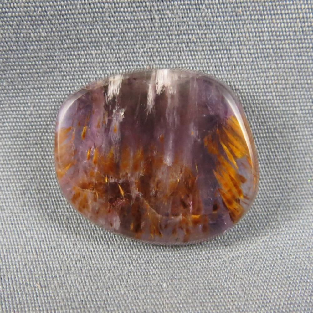Cacoxenite in Amethyst Cabochon