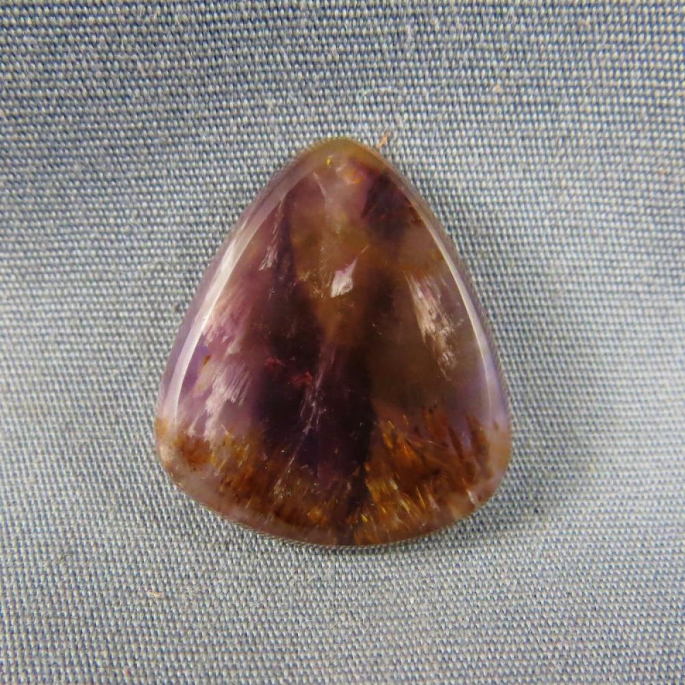 Cacoxenite in Amethyst Cabochon