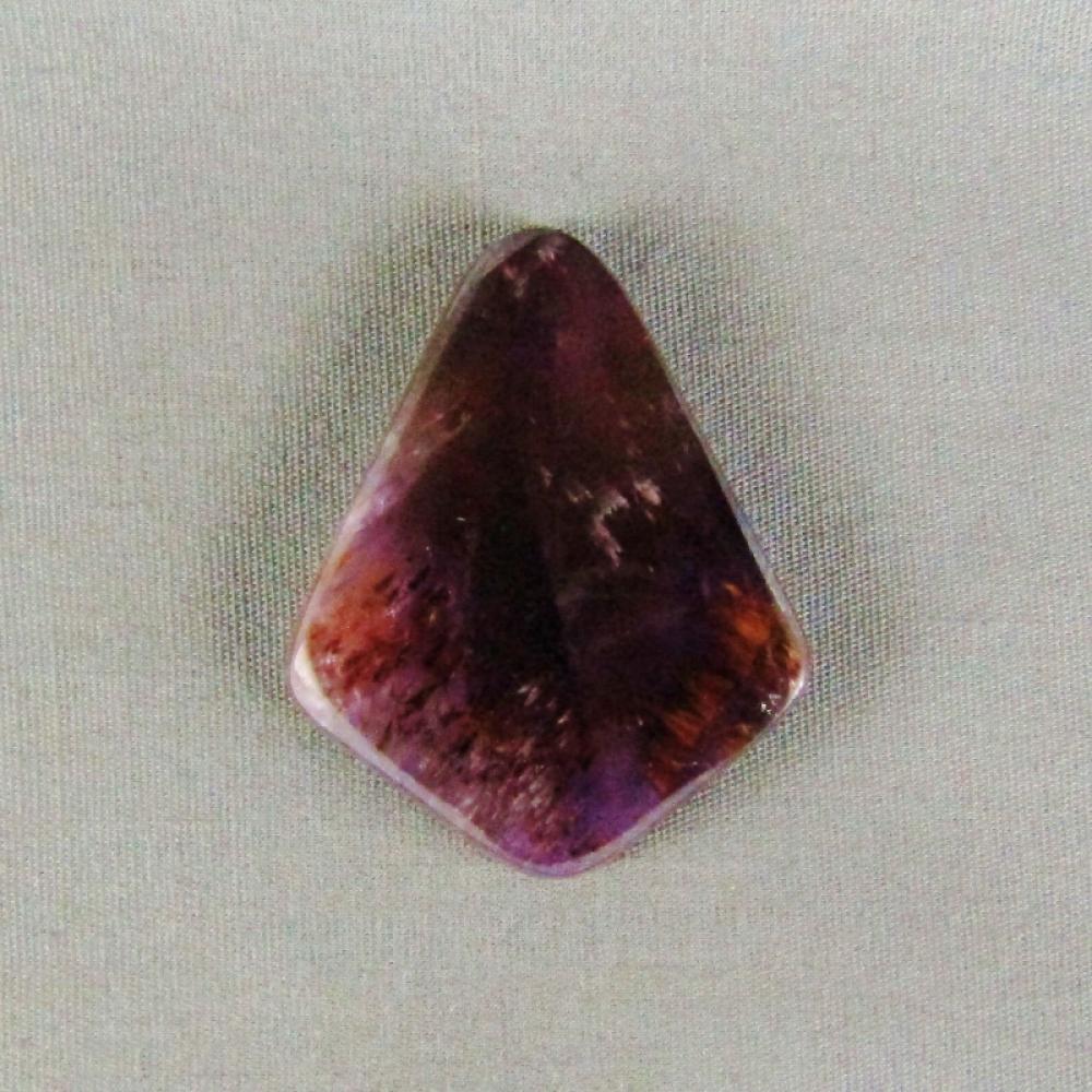 Cacoxenite in Amethyst Cabochon