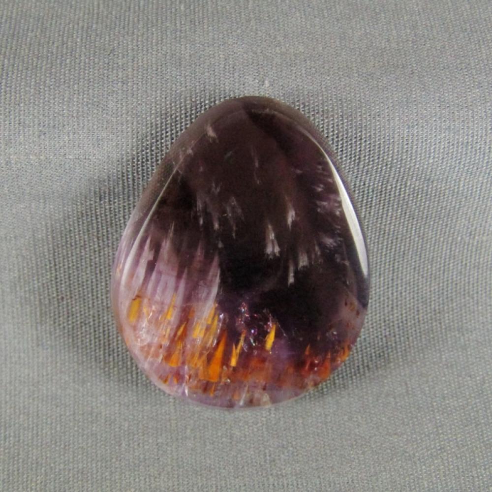 Cacoxenite in Amethyst Cabochon