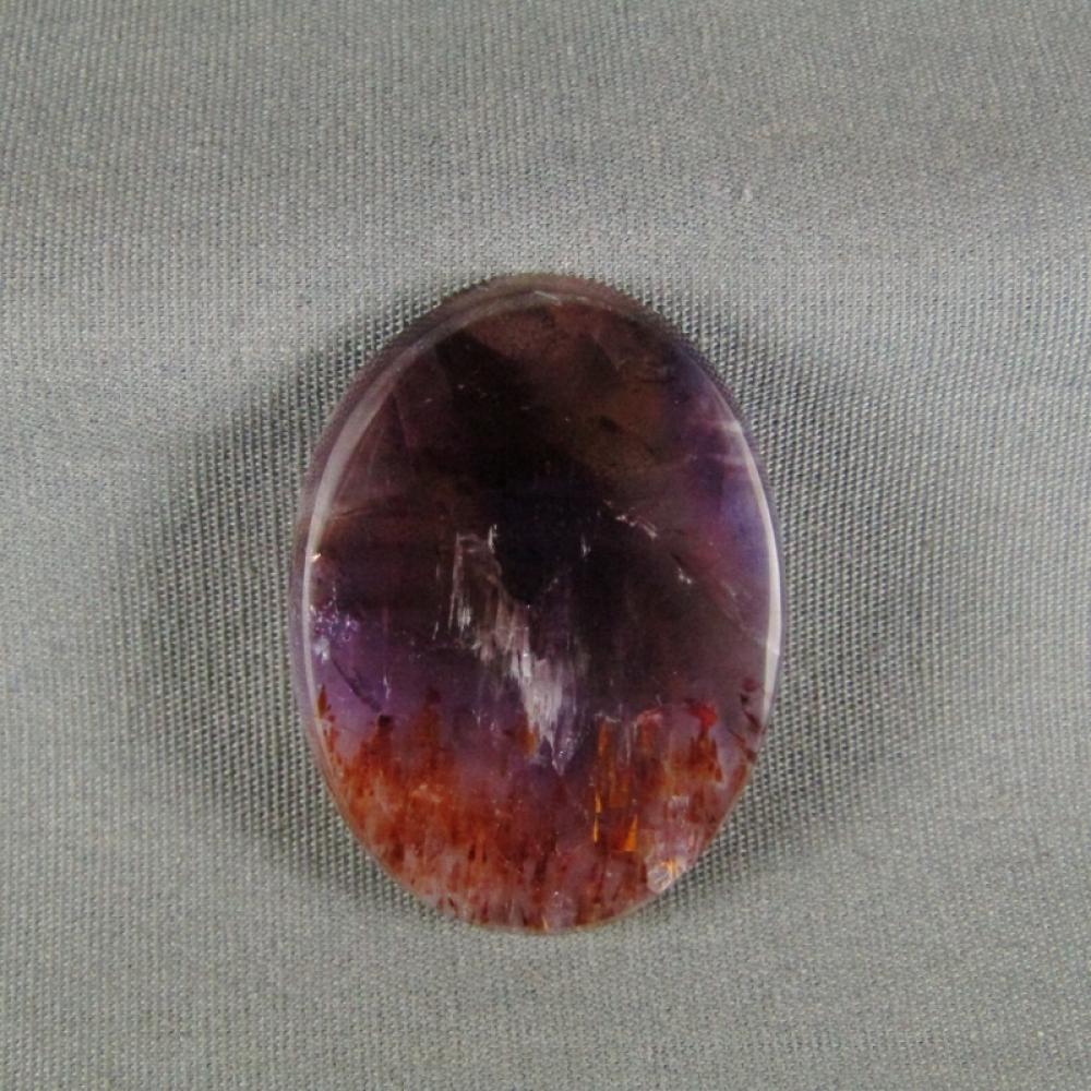Cacoxenite in Amethyst Cabochon