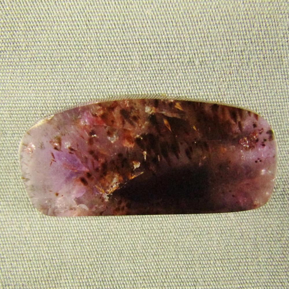 Cacoxenite in Amethyst Cabochon