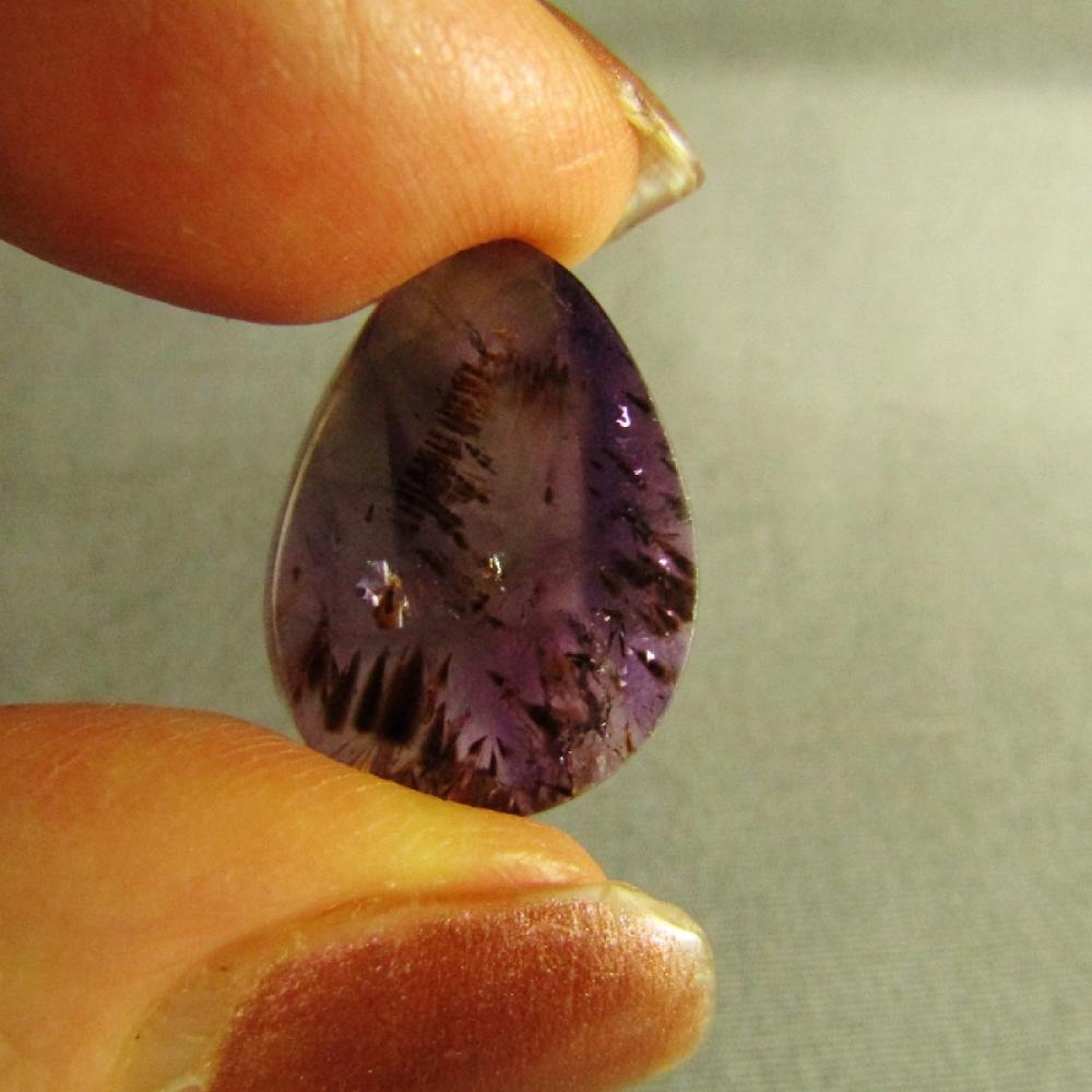 Cacoxenite in Amethyst Cabochon