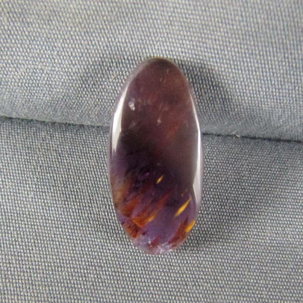 Cacoxenite in Amethyst Cabochon
