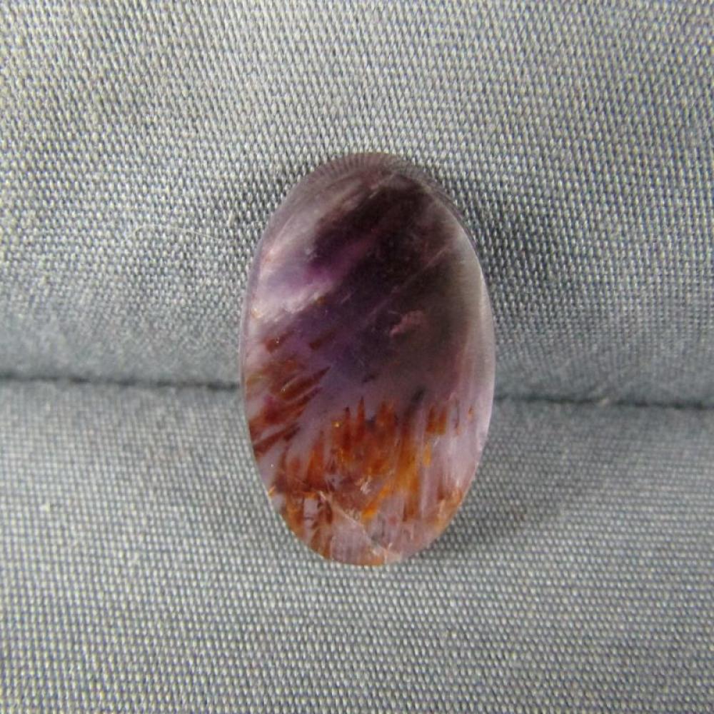 Cacoxenite in Amethyst Cabochon